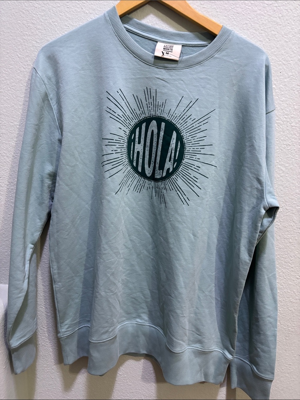 Heritage Light Blue Crewneck with Dark Teal 'HOLA' Sunburst Graphic
